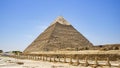 Giza, Egypt - May 20, 2019 : The Pyramid of Chephren and a road in the fields of the great pyramids of Egypt Royalty Free Stock Photo
